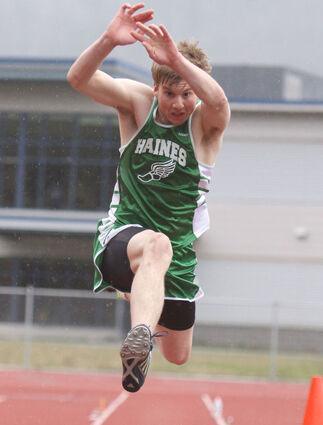 Chris Olsen of Haines leaps in the triple jump at last week’s Southeast championship track meet. Olsen won the event, jumping a distance that was the best of any jumper in the region. (Courtesy photo/Lori Giddings)