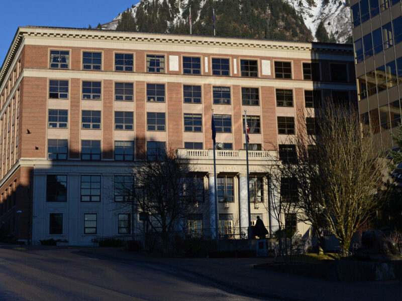 The Alaska State Capitol is illuminated by the sun on the morning of Jan. 9, 2023. (Photo by James Brooks/Alaska Beacon)