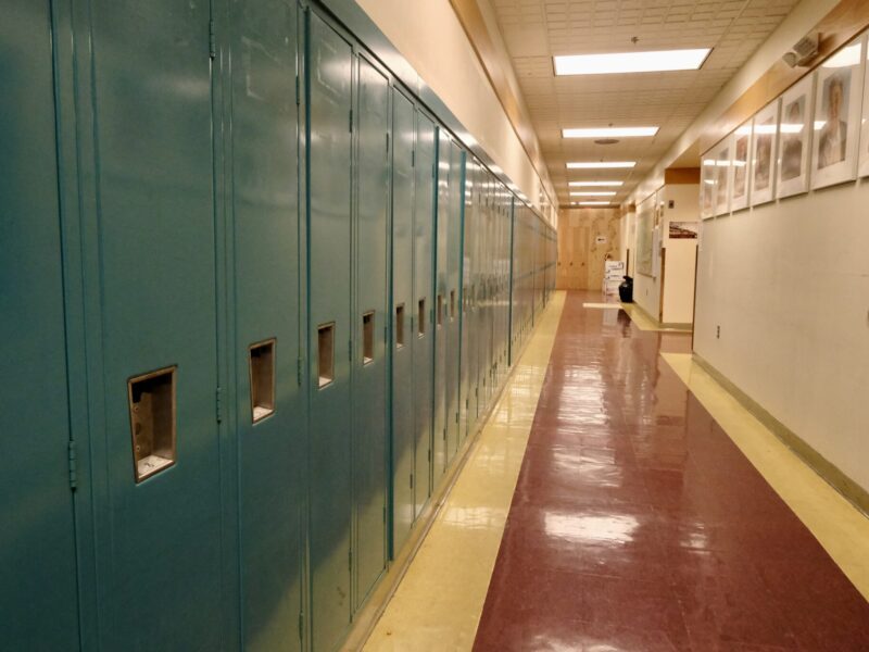 he halls are lined with lockers and portraits of elders at the Anna Tobeluk Memorial School in Nunapitchuk, Alaska. October 12, 2023. (Courtesy photo by Claire Stremple/Alaska Beacon)