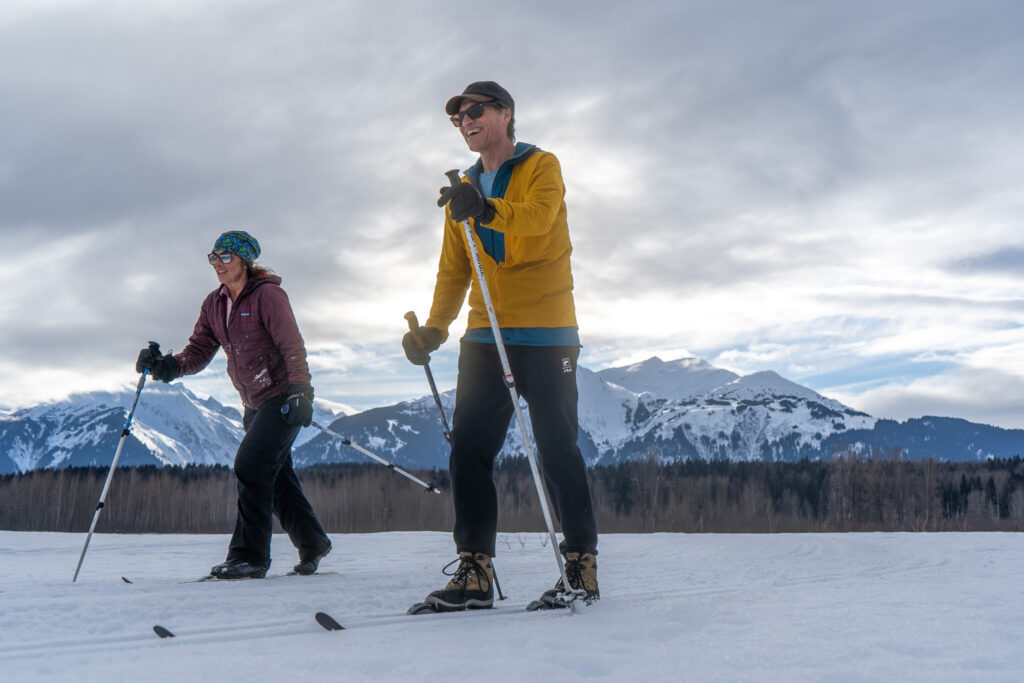 Laurie Mastrella and Scott Doddridge approach the finish of the Miles Klehini 10-kilometer race on Sunday. (Lex Treinen/Chilkat Valley News)