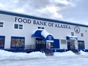 The Food Bank of Alaska sits under a layer of snow in downtown Anchorage. Staff members from the Food Bank of Alaska spoke to legislators in Juneau on Tuesday about issues they’re facing as a result of the SNAP crisis. (Photo by Sophia Carlisle/Alaska Beacon)