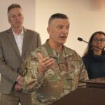 Adjutant General Torrence Saxe, head of the Alaska National Guard, speaks at a Sept. 23, 2022, news conference in Anchorage. Behind him are Gov. Mike Dunleavy and Rep. Mary Peltola. (Photo by Yereth Rosen/Alaska Beacon)