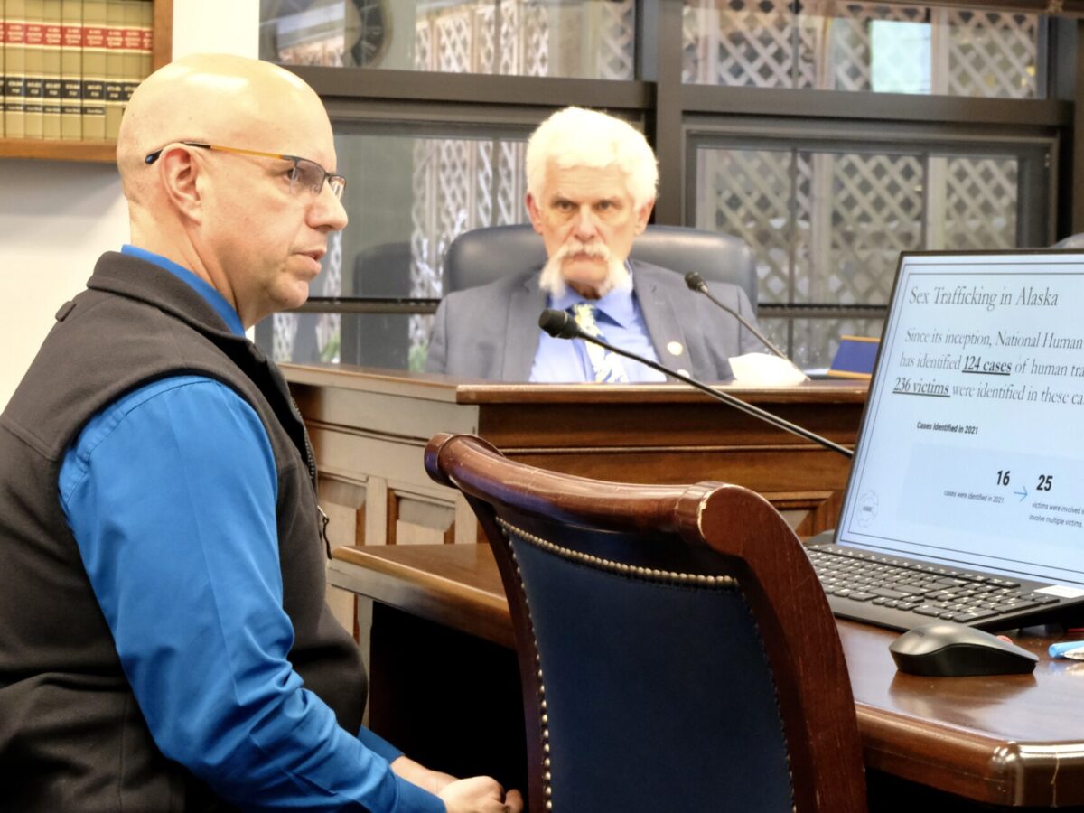 Alaska Department of Public Safety Deputy Commissioner Bryan Barlow testifies before the House Judiciary Committee on January 24, 2024. Rep. Cliff Groh, D-Anchorage looks on in the background. (Photo by Claire Stremple/Alaska Beacon)