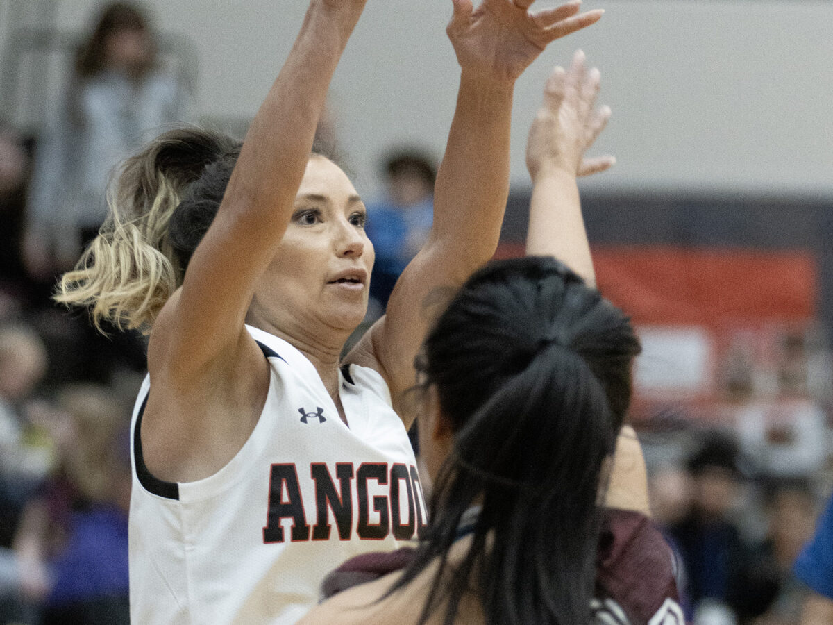 3-17-24 Angoon player Carmaleeda Estrada shoots over Haines player Karlie Spud. Haines defeated Angoon 53-35 during first round action of the Juneau Lions Club 75th Annual Gold Medal Basketball tornamet at the George Houston Gym JUNEAU-DOUGLAS HIGH SCHOOL: YADAA.AT KALÉ. Photo by: Brian Wallace/Chilkat Valley News