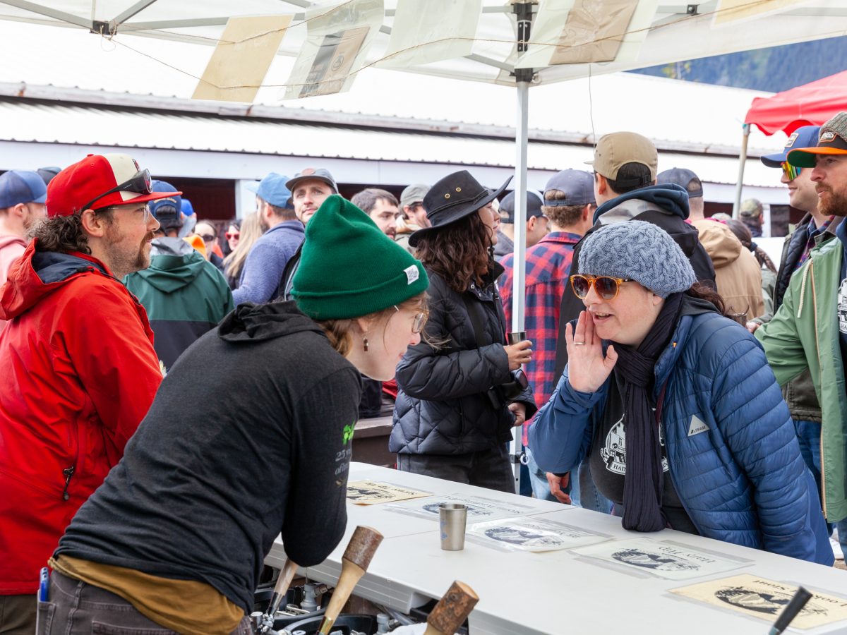 Wylie Betz (left) and Janine Allen serve beer for Haines Brewing on Saturday, May 25, 2024, at Beerfest in Haines, Alaska. (Rashah McChesney/Chilkat Valley News)