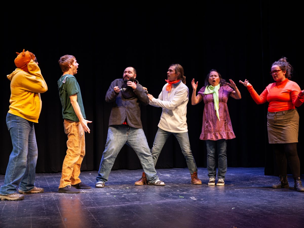 Members of the cast of Blaines City in rehearsal for a Scooby-Doo style skit about the town's former assessor on Tuesday, May 7, 2024, in Haines, Alaska. (Rashah McChesney/Chilkat Valley News)