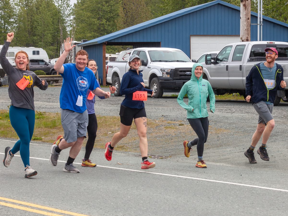A group of visitors runs a guerrilla 5k before Beerfest on Saturday, May 25, 2024, in Haines, Alaska. (Rashah McChesney/Chilkat Valley News)