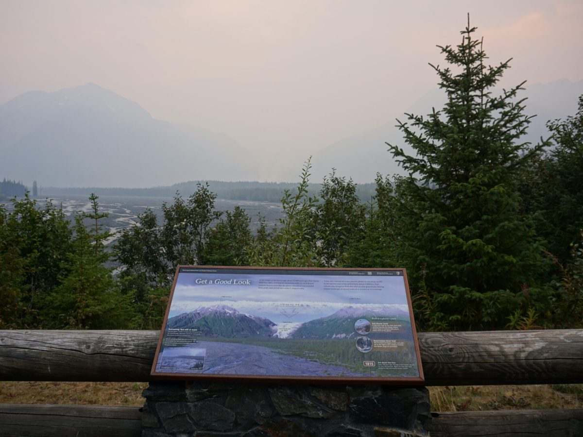 Smoke from the Swan Lake Fire burning in the Chugach National Forest obscures the view of Kenai Fjords National Park's Exit Glacier on Aug. 23, 2019. The glacier can normally be seen clearly from this visitor pullout established by the National Park Service. The Park Service is preparing a fire management plan for five coastal units, including Kenai Fjords. WIldfire smoke is one of the considerations in the plan. (Photo by Yereth Rosen/Alaska Beacon)
