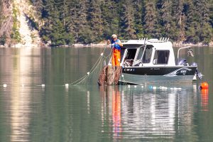 (Rashah McChesney/Chilkat Valley News) (left) Kelly Calver and husband Ray Calver fish near the mouth of the Chilkoot River on Monday, August 5, 2024, in Haines, Alaska. The two came from Skagway and said it was a slow day.
