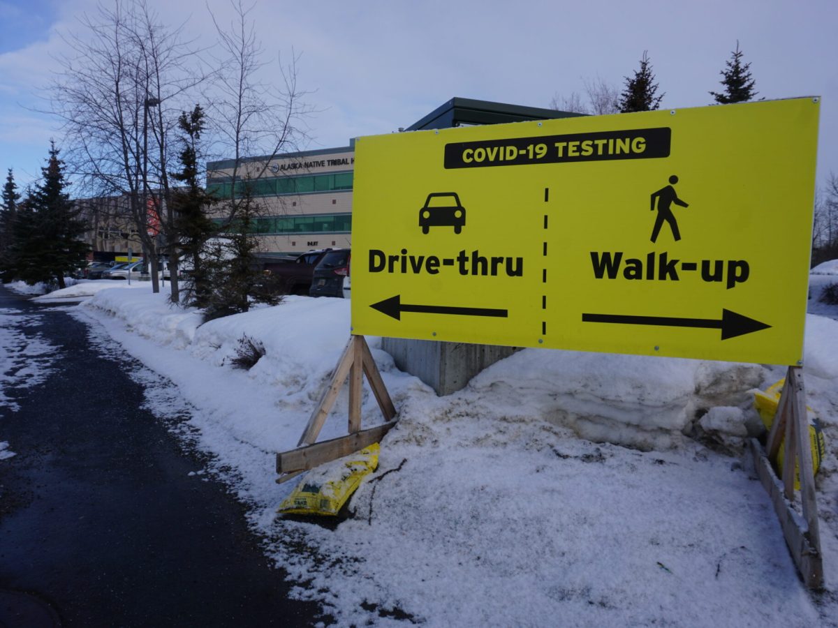 Signs posted on March 31, 2021, direct visitors to COVID-19 testing sites on the Alaska Native Tribal Health Consortium campus in Anchorage. Average life expectancy in Alaska declined that year more than in any other U.S. state, the U.S. Centers for Disease Control and Prevention says. Nationally, life expectancy declined, a trend driven by COVID-19 but also by drug overdoses, health experts say. (Photo by Yereth Rosen/Alaska Beacon)