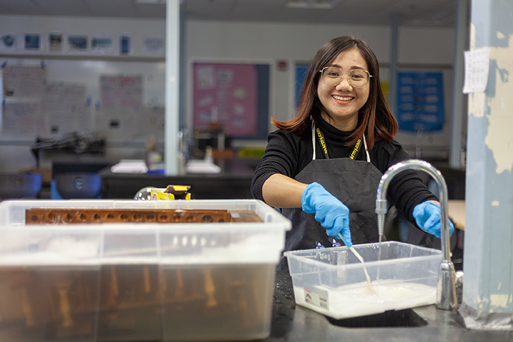Rena Gopez is the Haines Borough School District's newest high school science teacher, shown here cleaning test tube holders on Tuesday, Oct. 15, 2024, in Haines, Alaska. (Rashah McChesney/Chilkat Valley News)
