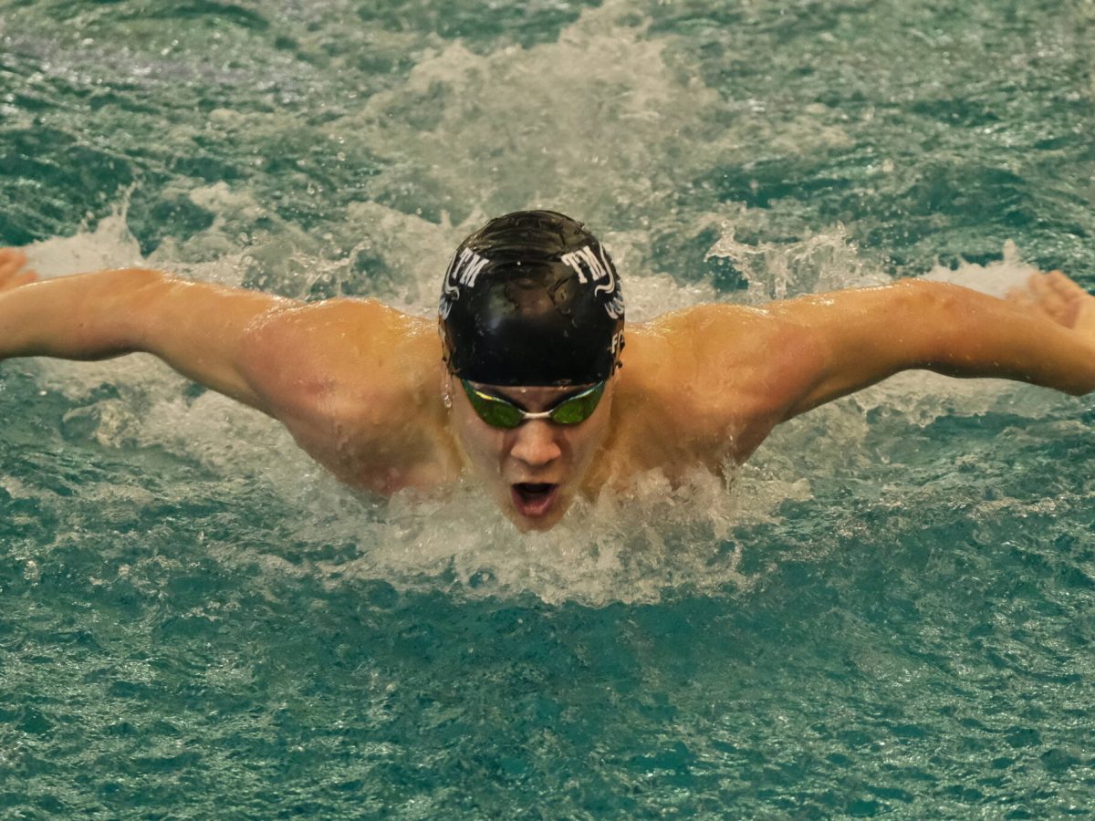 Juneau’s PJ Foy, shown winning the 2023 100-yard butterfly in 48.27 for Thunder Mountain High School during the ASAA state championships at the Dimond Park Aquatics Center on Nov. 4, 2023. (Klas Stolpe / Juneau Empire file photo)