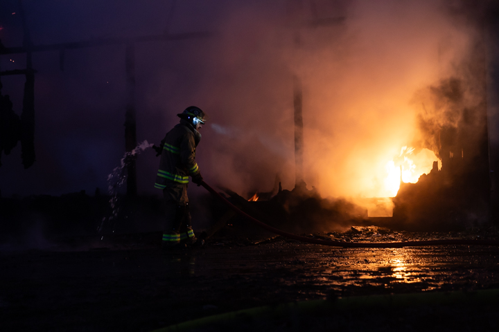 Thom Andriesen works to contain a fire in the Old Field Kitchen restaurant on Saturday, Dec. 7, 2024, in Haines, Alaska.