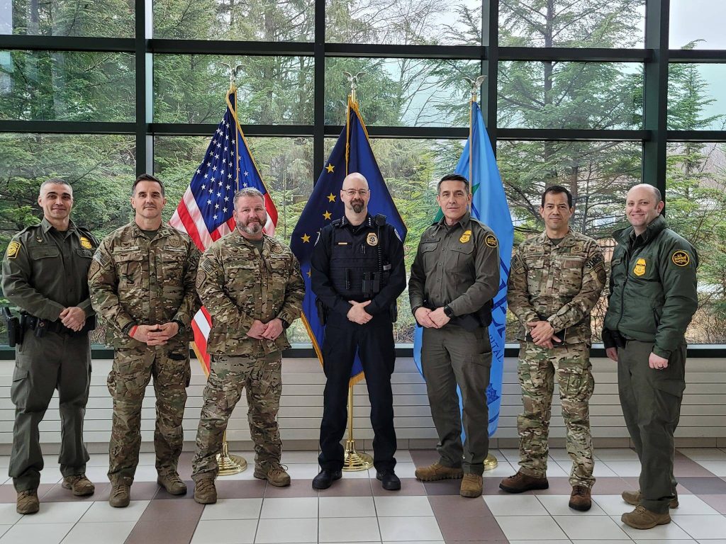 U.S. Border Patrol officials meet with Juneau Police Chief Derek Bos (center) on April 12, 2024, in Juneau. (Courtesy/U.S. Border Patrol)