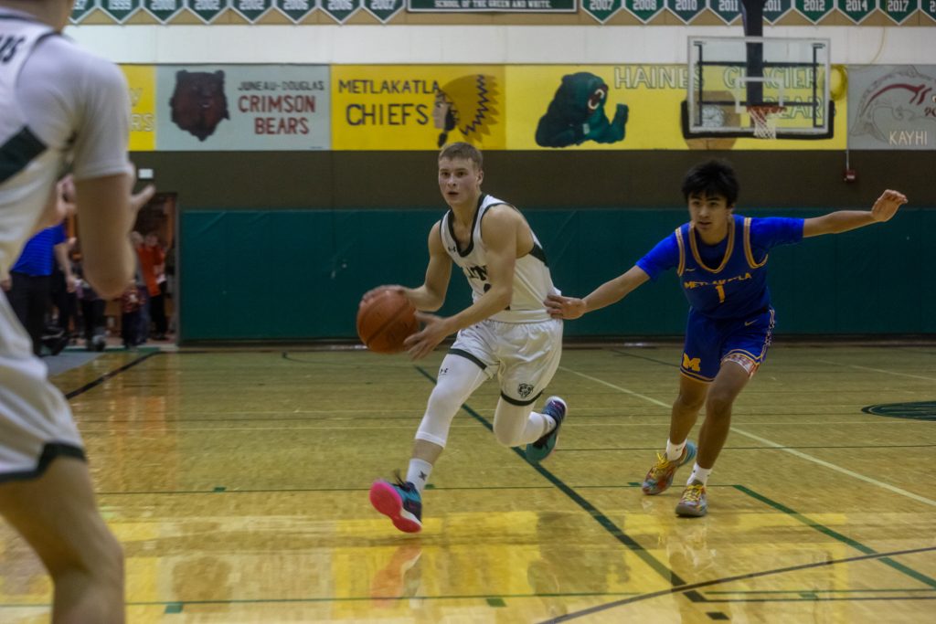 Haines' Colton Combs looks for an opening to pass as during a game against the Metlakatla Chiefs on Friday, Jan. 10, 2025, in Haines, Alaska. (Rashah McChesney/Chilkat Valley News)