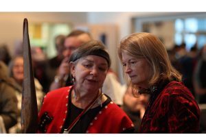 Alaska U.S. Sen. Lisa Murkowski (right) listens to Katherine George-Byrd ahead of Saturday's bombardment apology ceremony. George-Byrd, a Kiks'adi clan mother, talked to the senator about the at.óow on the table before them. At.óow are clan items that provide a connection between current clan members and their ancestors. (Courtesy/Sam Pausman, Wrangell Sentinel)