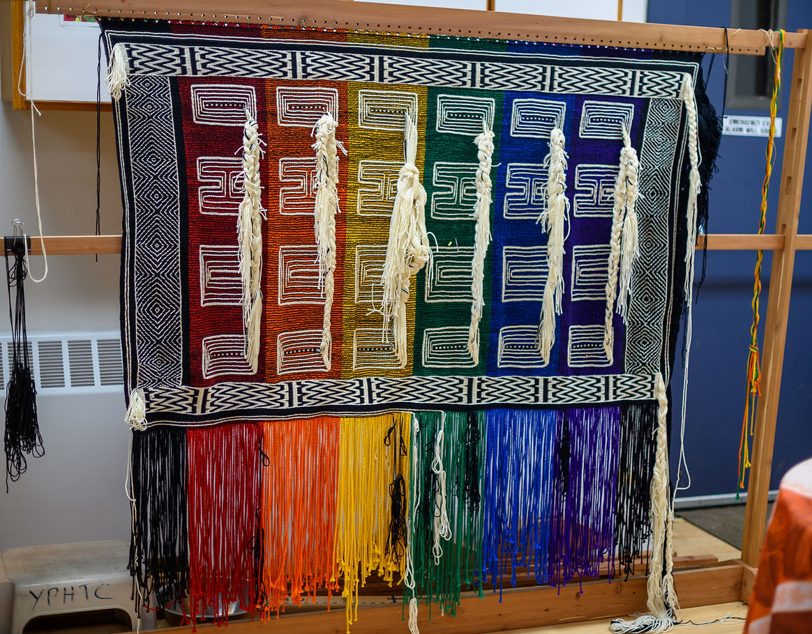 The nearly finished “Weaving Our Pride” Ravenstail robe in February 2026. (Jasz Garrett / Juneau Independent)