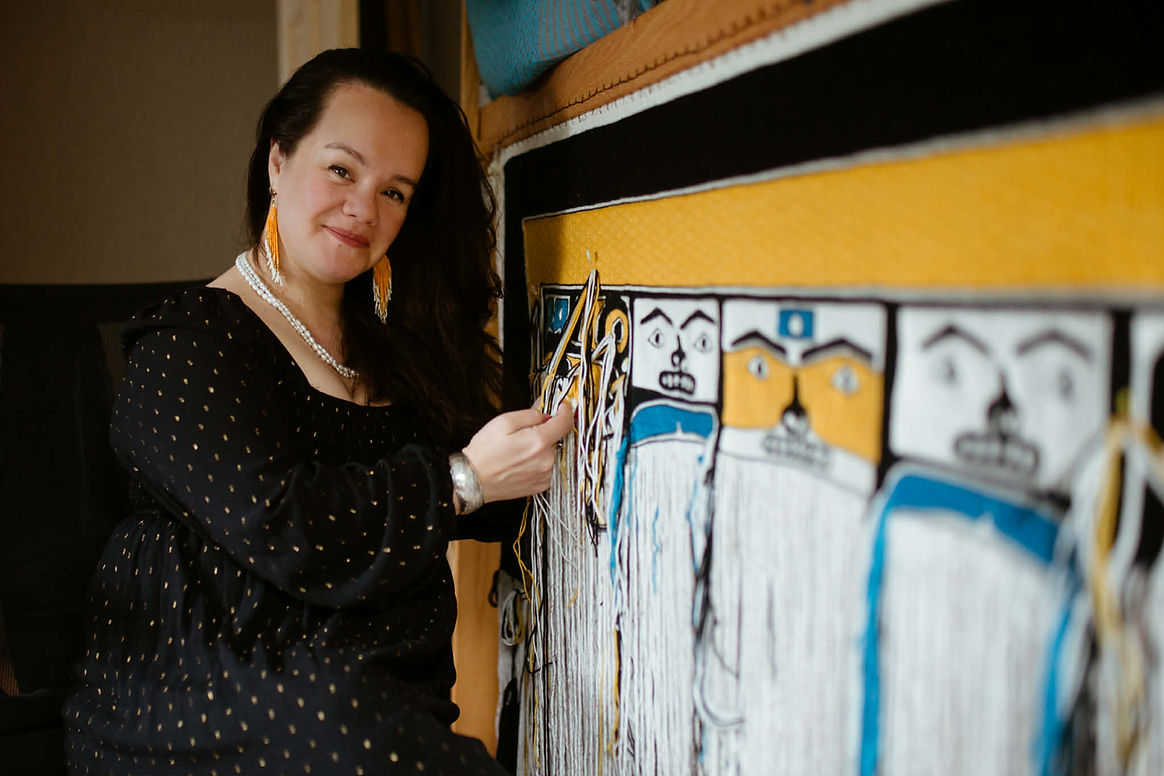 Lily Hope weaves a Chilkat dancing blanket for the de Young Museum in San Francisco, which is now completed. (Photo by Sydney Akagi)